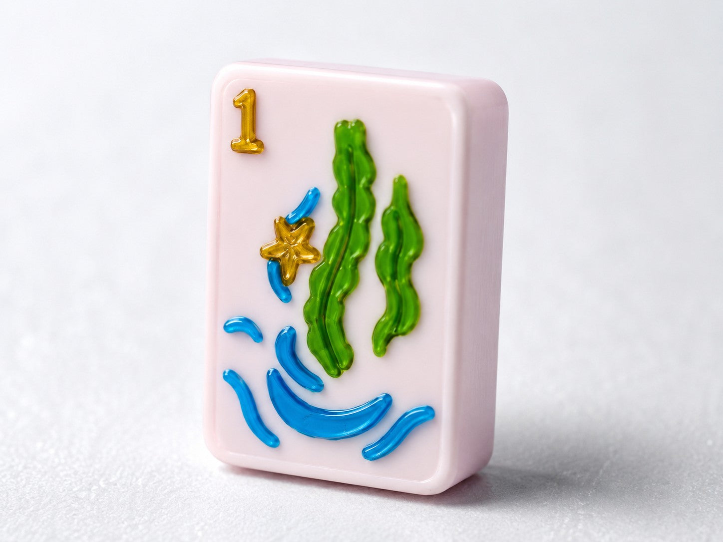 Floating American mahjong tile with deep raised-relief embossed face